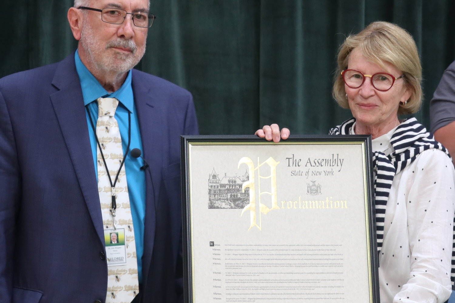 Dr. John Morgano, left, accepts a New York State proclamation from Assemblywoman Aileen Gunther, a dear friend, on the occasion of his retirement from the Eldred Central School District.